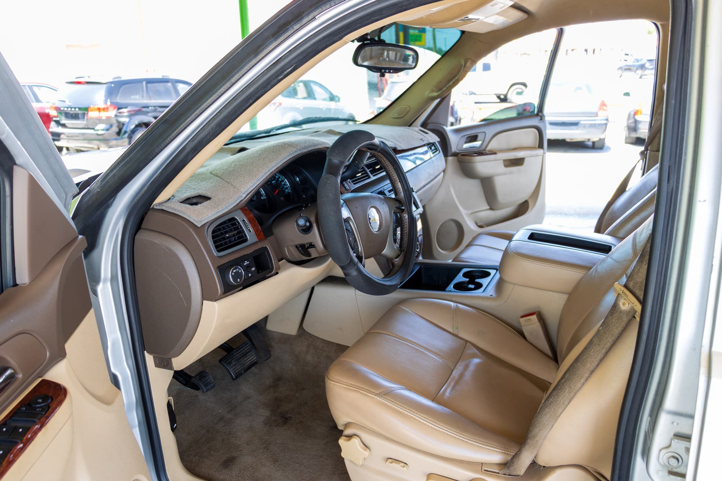 2011 Chevrolet Tahoe LT, driver's door open showing front seat